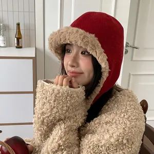 Korean style red winter trapper hat with warm khaki faux fur lining for women indoors