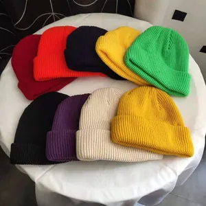 Detailed view of colorful unisex knitted beanie hats available in various vibrant shades
