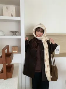 Detailed view of model wearing a cozy Korean style plush hooded scarf with star patterns