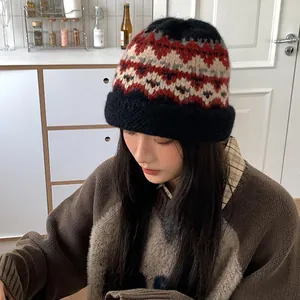 Vintage folk style knitted wool beanie for women with colorful pattern and black brim