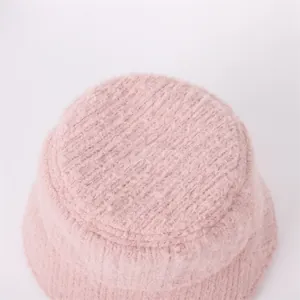 Detailed view showing the soft pink fuzzy texture and thick knit of this winter bucket hat
