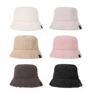 Detailed view of warm winter plush bucket hats in six trendy colors with soft fuzzy texture