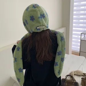 Green plush hooded scarf with blue flower patterns and integrated neck warmer