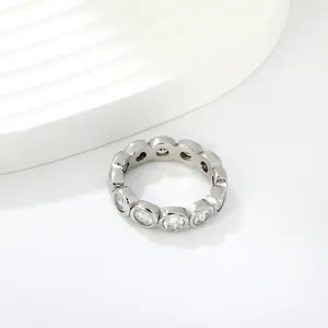 Close-up detail of a silver stainless steel eternity ring with sparkling white zircons