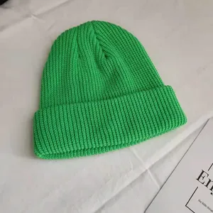 Bright green ribbed knit beanie hat for street style, autumn wear, and casual look