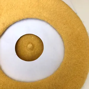 Detailed top view of a yellow wool beret showing felted texture and classic design.