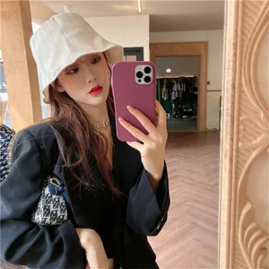 Elegant white pleated bucket hat for women featuring sun protection and a chic minimalist style