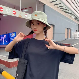 Close-up of a sweet Japanese style bucket hat with a cute pumpkin embroidery for women.