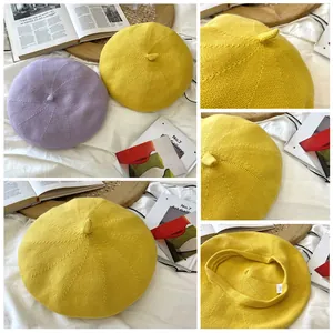 Detail of a breathable yellow knitted cotton beret with soft texture and 100% cotton label