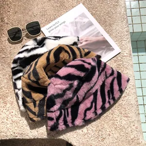 Close-up of stylish plush zebra pattern bucket hats in multiple colors for winter