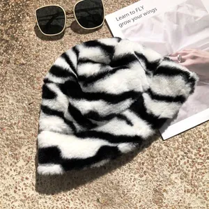 Close-up detail showing the soft plush texture of a black and white zebra-print bucket hat