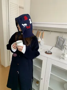 Cozy dark blue knitted balaclava hat with cute red and white cartoon cat patterns
