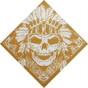 Macro view of a stylized Indian skull and feather print on a gold cotton bandana