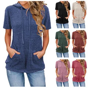 Detail view of women's short sleeve hooded t-shirt with pockets in multiple colors