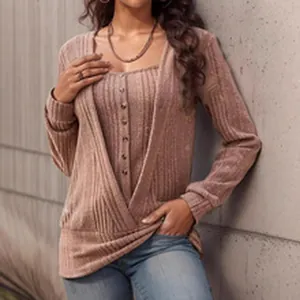 Detailed view of women's mauve ribbed knit cardigan and button-front top layered set