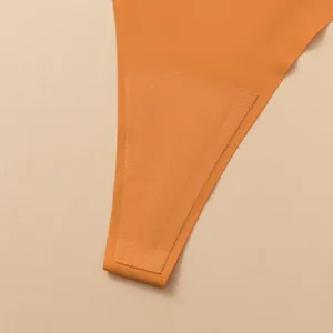 Premium seamless orange thong underwear with breathable inner lining for women's comfort