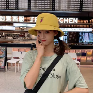 Close-up of a sweet yellow bucket hat featuring cute eggplant embroidery for women