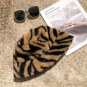 Stylish tiger stripe plush bucket hat shown with fashion accessories in a detailed view