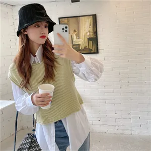 Close-up of black corduroy bucket hat on model showing texture and stylish fitting.