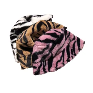 Stylish zebra pattern plush bucket hats for winter warmth available in three vibrant colors.
