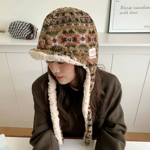 Cozy Fair Isle patterned plush trapper hat with warm fleece lining and ear flaps