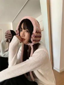 Stylish pink striped plush earmuffs with soft faux fur for cozy winter outdoor warmth.