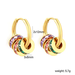 Detail of gold stainless steel hoop earrings with colorful crystal charms and 5.7g weight