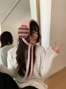 Stylish women's pink plush earmuffs, perfect for cozy winter warmth and protection