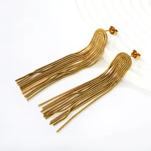 Detail showing irregular long tassel earrings crafted with golden snake chain strands.