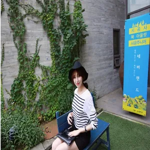 Elegant black felt wide-brim hat for women worn in an outdoor lifestyle setting