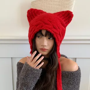 Vibrant red knitted cat ear hat with ear flaps for winter warmth and style