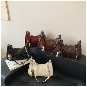 Stylish collection of chic croc-embossed dumpling crossbody bags shown in five elegant colors