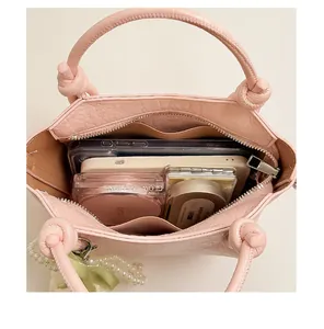 Detailed top-down interior view of pink retro bucket bag showing its spacious capacity