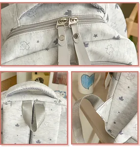 Close-up views of the backpack zippers, top handle, and durable strap attachment points