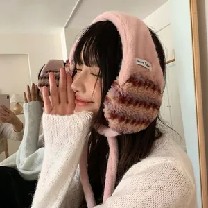 Cozy pink plush winter earmuffs with a striped pattern for women, Korean style