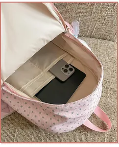Internal storage compartments showing tablet and phone pockets in pink star backpack