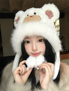 Close-up of a sweet and fluffy white bear trapper hat featuring red gingham bows