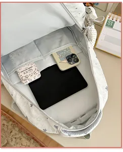 Interior view of star pattern backpack with dedicated compartments for tablet and phone.