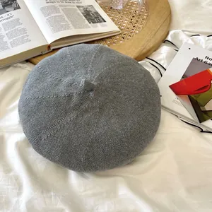 Detailed view of a gray breathable knitted beret hat featuring a thin retro texture