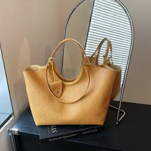 Stylish yellow woven tote bag with large capacity displayed in a modern lifestyle setting