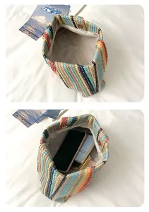 Interior view of colorful striped straw woven bag showing spacious storage capacity.