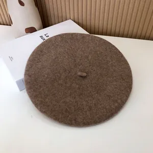 Detailed view of the soft brown wool texture on this classic minimalist beret