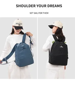 Asian model wearing minimalist blue and black backpacks for casual and outdoor use.