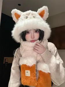 Detailed view of the cute plush cat ear hat and scarf set on a female model for winter