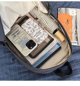 Detail view showing the large capacity and interior of the gray minimalist backpack