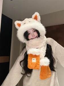 Close-up of plush fox ear hat and scarf set with cute embroidered eye details for winter