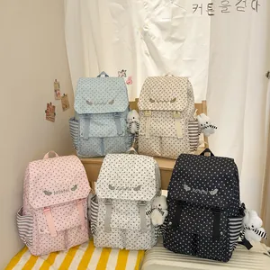 Stylish set of five women's star pattern backpacks with cute plush teddy bear charms.