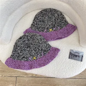 Handmade mixed grey and purple crochet bucket hat with stylish embroidery details