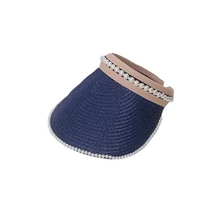 Elegant navy blue straw sun visor hat for women featuring stylish white pearl embellishments