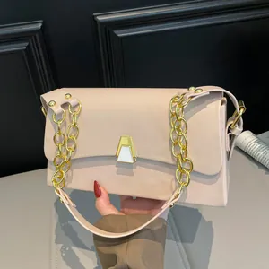 Elegant beige square handbag featuring gold chain strap and geometric clasp detail